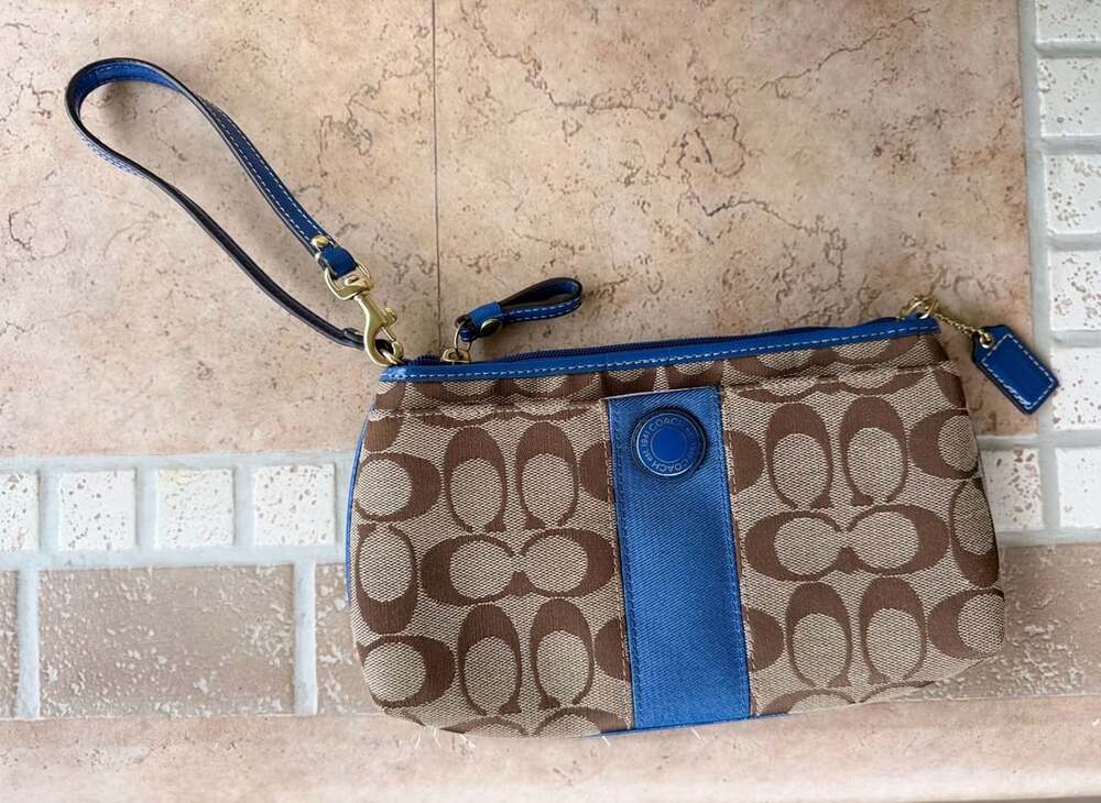 Blue and tan coach wristlet